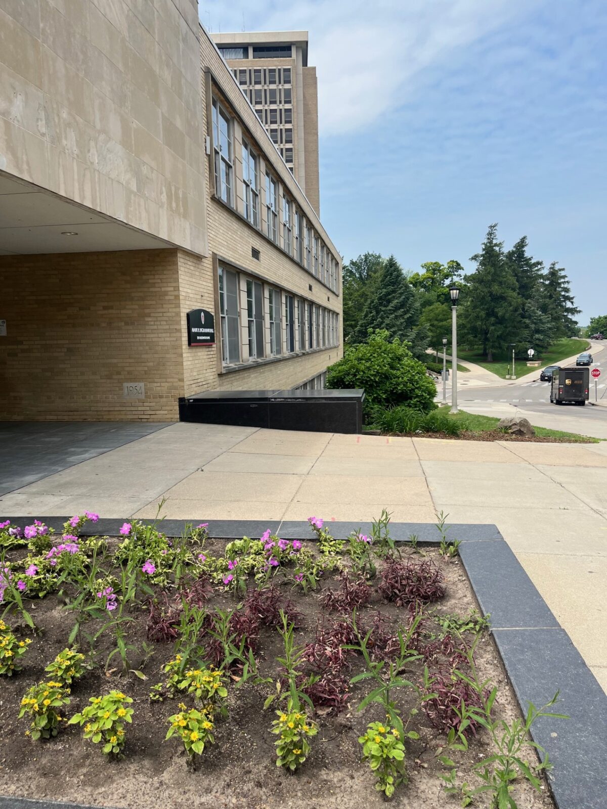 Exterior of Ingraham Hall, facing the Observatory Drive entrance, with Van Hise Hall in the background.