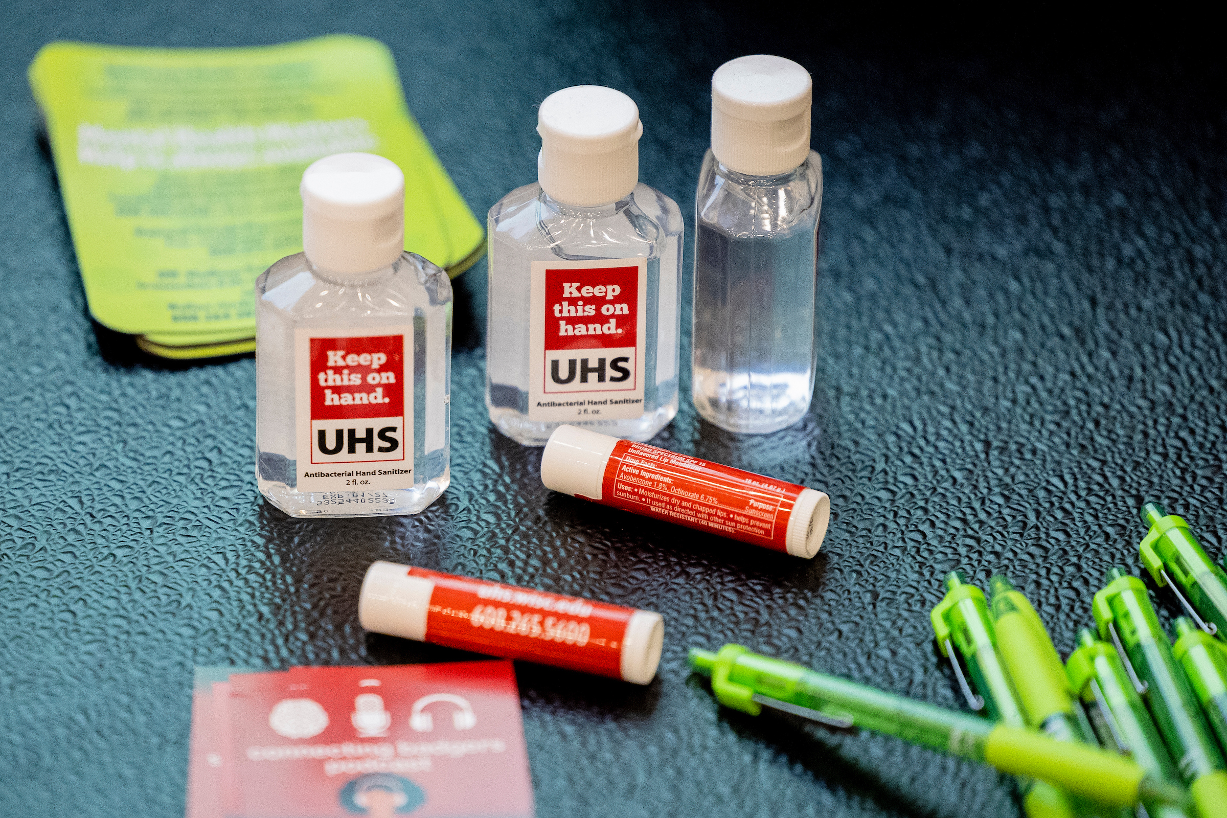 UHS branded hand sanitizer, pamphlets, and chap stick were free to take during a Mental Health Workshop hosted by University Health Services (UHS) focused on mental health, anxiety, and helping build skills to help a friend in need of mental health support in the Bakke Serenity Room at the University of Wisconsin–Madison on December 12, 2023. (Photo by Taylor Wolfram / UW–Madison)