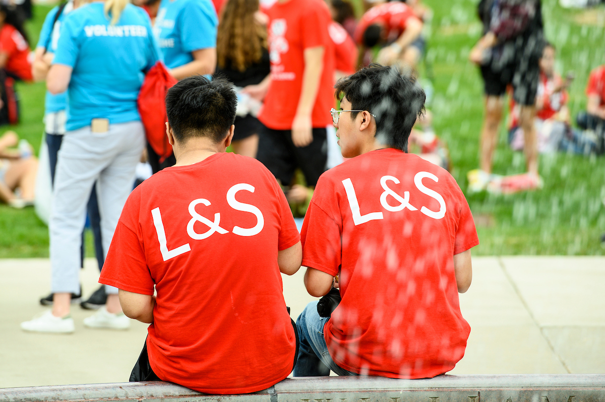 Incoming first-year students wearing red "College of Letters & Science" shirts attend a Chancellor's luncheon on Library Mall ahead of the Chancellor's Convocation.