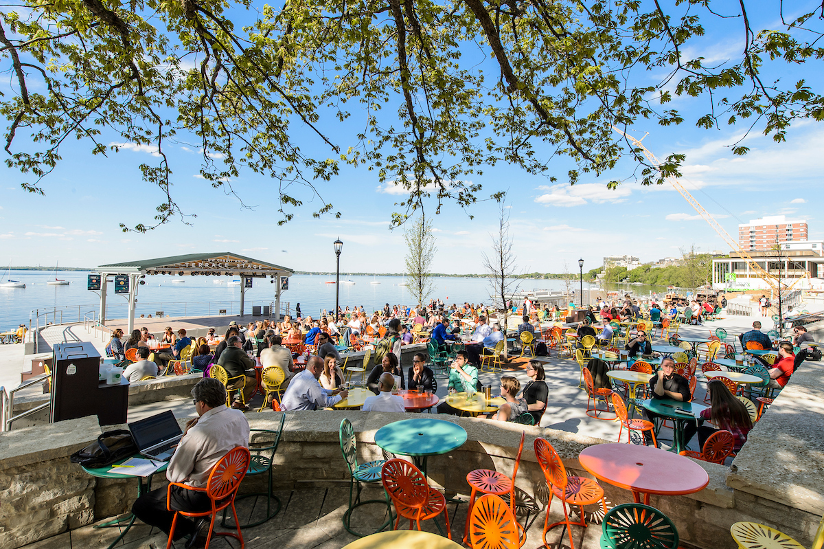 visitors to the Memorial Union Terrace enjoy a warm spring day on the shore of Lake Mendota at the University of Wisconsin-Madison